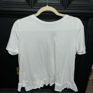 Plain white tee shirt with ruffle in back
